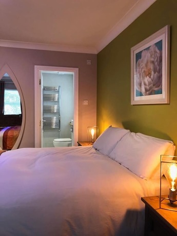 Imagen de la habitación del Hotel Amber Heights Guesthouse. Foto 14