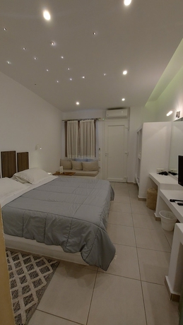 Imagen de la habitación del Hotel Ambience Suites. Foto 12