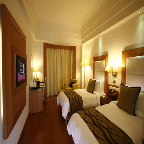 Imagen de la habitación del Hotel Ambrosia Sarovar Portico Haridwar. Foto 9