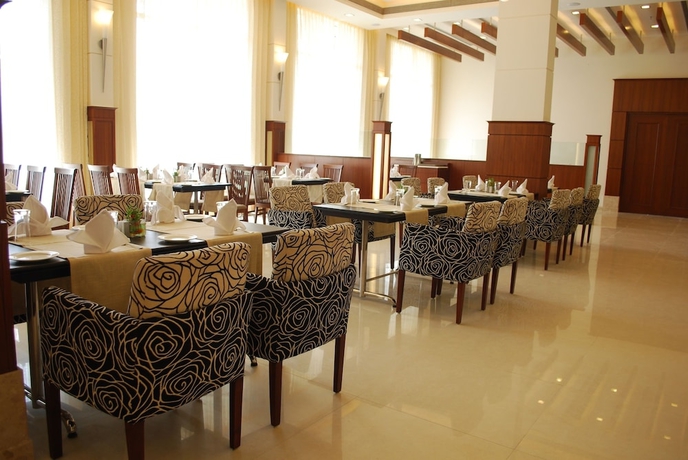 Imagen del bar/restaurante del Hotel Ambrosia Sarovar Portico Haridwar. Foto 3