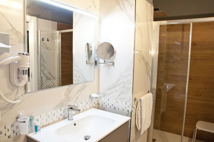 Imagen de la habitación del Hotel Ambruosi Village Resort and Spa. Foto 17