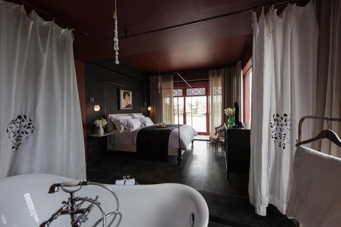 Imagen de la habitación del Hotel Amdaeng Bangkok Riverside. Foto 4