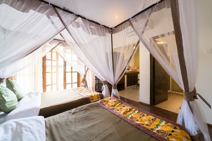 Imagen de la habitación del Hotel Ameg Lodge Kilimanjaro. Foto 18