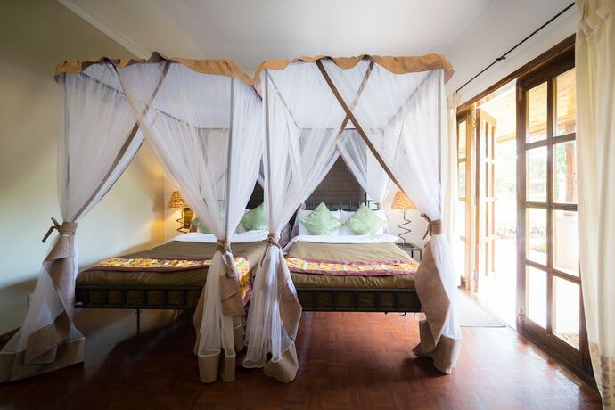 Imagen de la habitación del Hotel Ameg Lodge Kilimanjaro. Foto 19