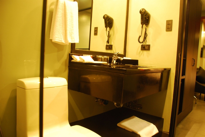 Imagen de la habitación del Hotel Amelie Manila. Foto 3