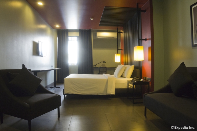 Imagen de la habitación del Hotel Amelie Manila. Foto 9