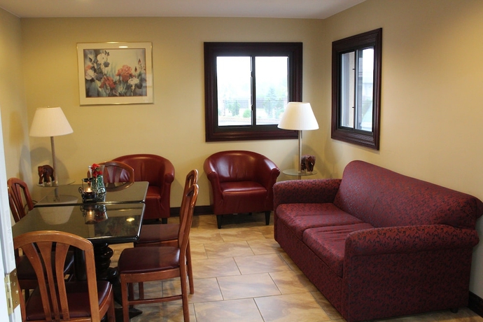 Imagen del bar/restaurante del Hotel American Inn and Suites, Countryside. Foto 2