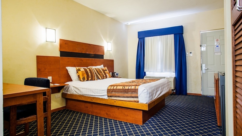 Imagen de la habitación del Hotel American Inn and Suites Hidalgo Del Parral. Foto 11