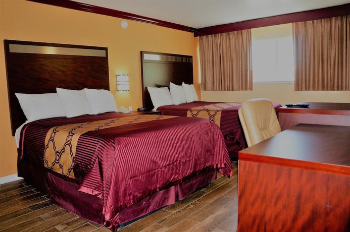 Imagen de la habitación del Hotel America's Deluxe Inn. Foto 10