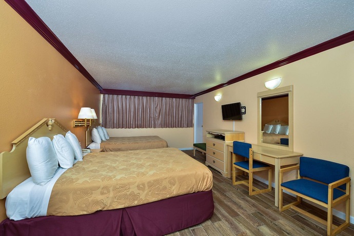 Imagen de la habitación del Hotel America's Deluxe Inn. Foto 16