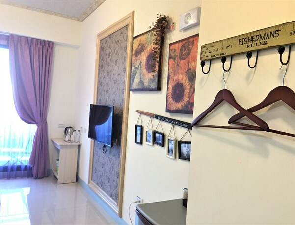 Imagen de la habitación del Hotel Amibao Resort. Foto 13