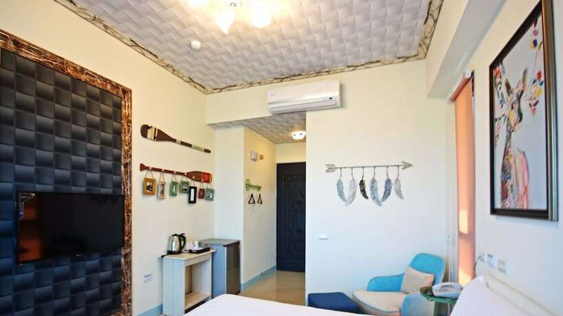 Imagen de la habitación del Hotel Amibao Resort. Foto 22