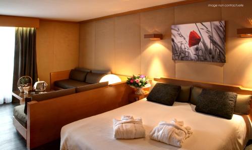 Imagen de la habitación del Hotel Amirauté Hôtel Golf Deauville. Foto 9