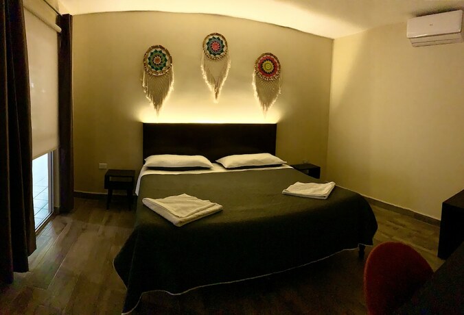 Imagen de la habitación del Hotel Ammare boutique. Foto 15