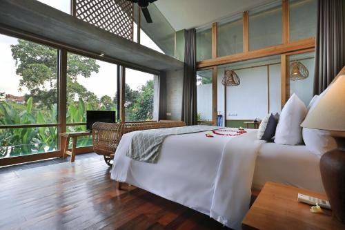 Imagen de la habitación del Hotel Amora Ubud Boutique Villas. Foto 9