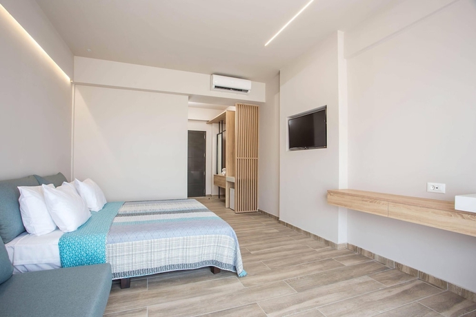 Imagen de la habitación del Hotel Ampelia Seaside Resort. Foto 6