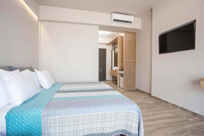 Imagen de la habitación del Hotel Ampelia Seaside Resort. Foto 9