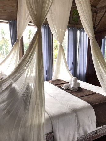 Imagen de la habitación del Hotel Ananda JJ Ubud Resort and Spa. Foto 11