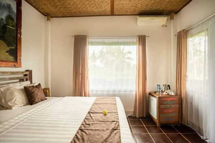 Imagen de la habitación del Hotel Ananda JJ Ubud Resort and Spa. Foto 13