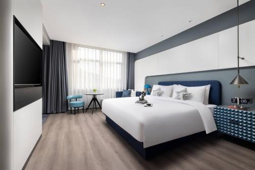 Imagen de la habitación del Hotel Anbo M Yiwu Wanda Plaza. Foto 19