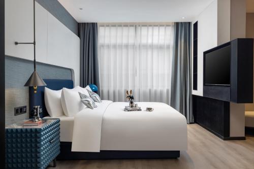 Imagen de la habitación del Hotel Anbo M Yiwu Wanda Plaza. Foto 20