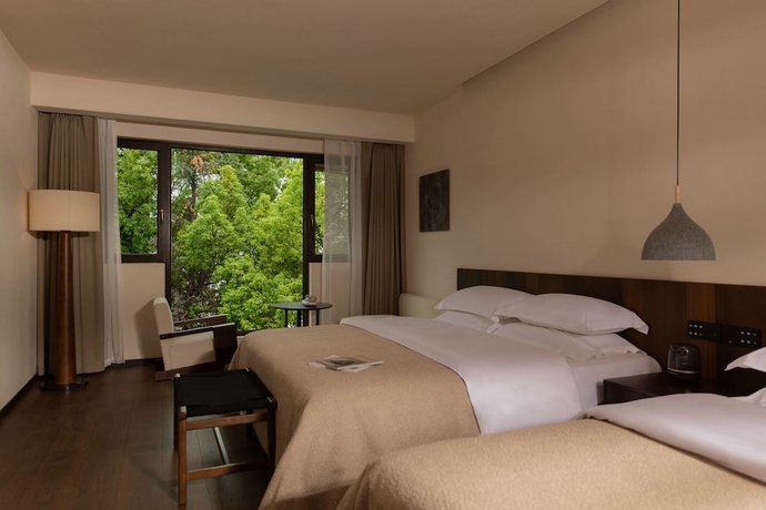 Imagen de la habitación del Hotel Ancient Charm Luxe Retreat Lijiang. Foto 4