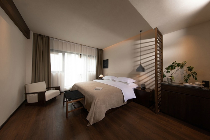 Imagen de la habitación del Hotel Ancient Charm Luxe Retreat Lijiang. Foto 6
