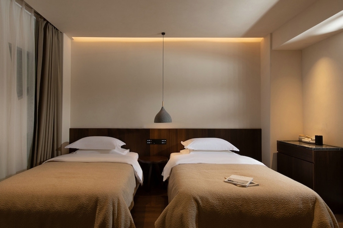 Imagen de la habitación del Hotel Ancient Charm Luxe Retreat Lijiang. Foto 8