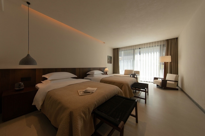 Imagen de la habitación del Hotel Ancient Charm Luxe Retreat Lijiang. Foto 11