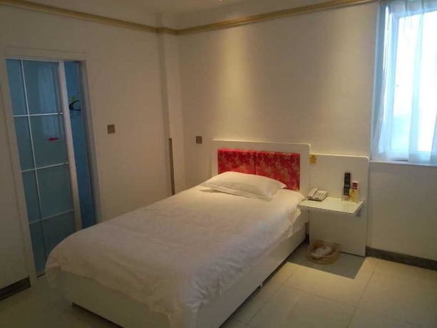 Imagen de la habitación del Hotel Ancient Culture Business Hotel. Foto 12