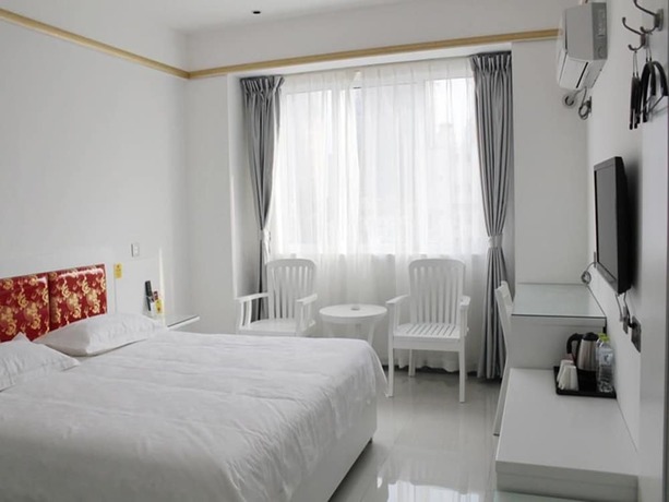 Imagen de la habitación del Hotel Ancient Culture Business Hotel. Foto 19