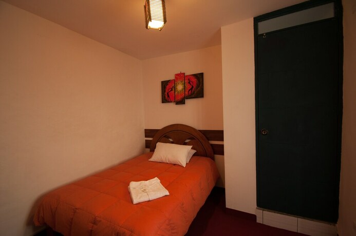 Imagen de la habitación del Hotel Andean Home. Foto 15