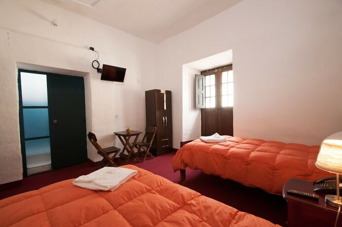 Imagen de la habitación del Hotel Andean Home. Foto 17