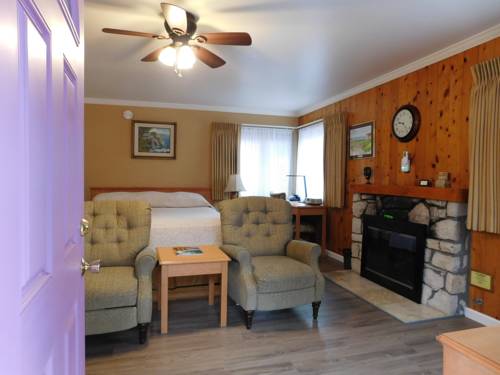 Imagen de la habitación del Hotel Andril Fireplace Cottages. Foto 14