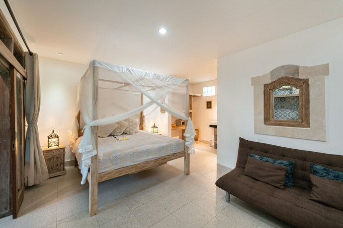 Imagen de la habitación del Hotel Angel House Ubud. Foto 24