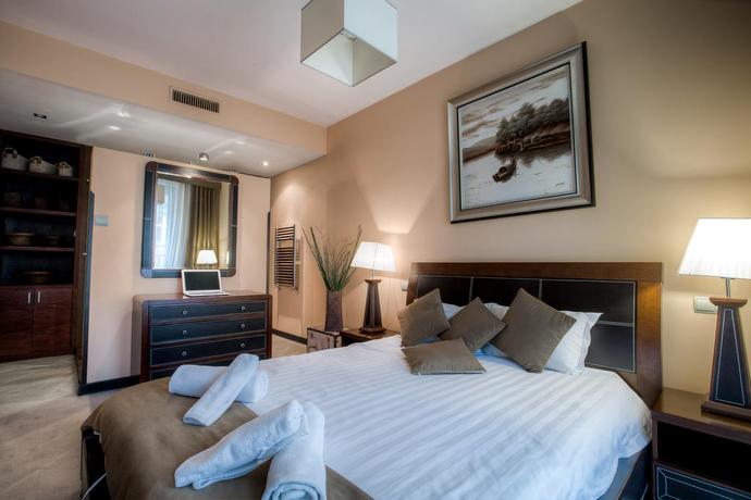 Imagen de la habitación del Hotel Angel Plaza Apartments. Foto 8