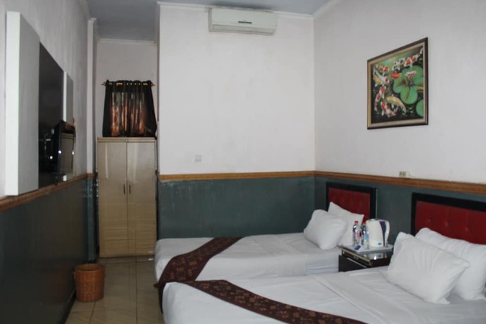 Imagen de la habitación del Hotel Anggraeni Ketanggungan. Foto 10