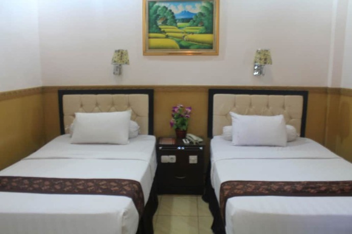 Imagen de la habitación del Hotel Anggraeni Ketanggungan. Foto 12