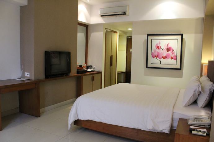 Imagen de la habitación del Hotel Anggrek Shopping Hotel. Foto 12