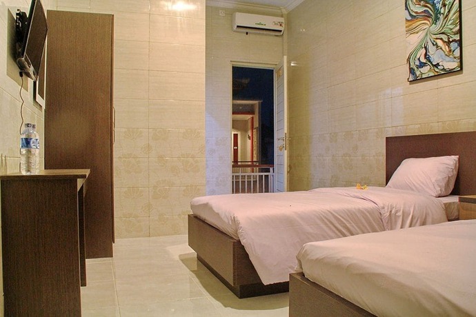 Imagen de la habitación del Hotel Angkul Angkul Beach In Kuta. Foto 2