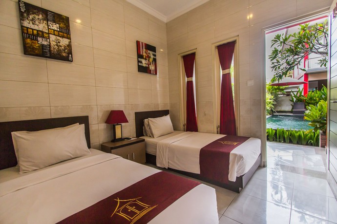 Imagen de la habitación del Hotel Angkul Angkul Beach In Kuta. Foto 4