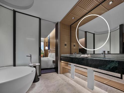 Imagen de la habitación del Hotel Angsana Suzhou Shishan. Foto 6