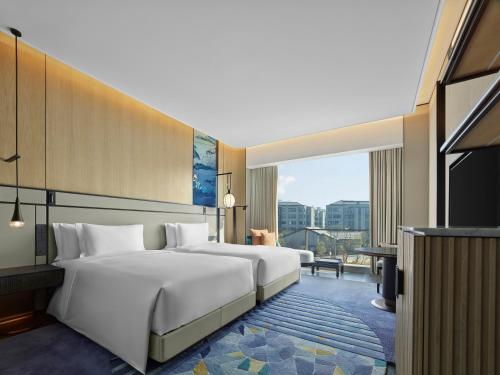 Imagen de la habitación del Hotel Angsana Suzhou Shishan. Foto 8