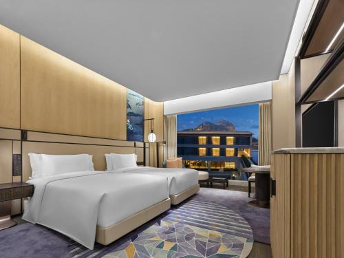 Imagen de la habitación del Hotel Angsana Suzhou Shishan. Foto 11
