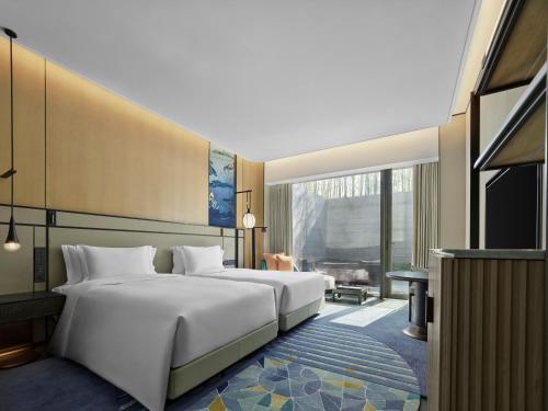 Imagen de la habitación del Hotel Angsana Suzhou Shishan. Foto 13