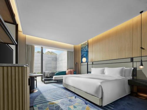 Imagen de la habitación del Hotel Angsana Suzhou Shishan. Foto 14