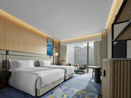 Imagen de la habitación del Hotel Angsana Suzhou Shishan. Foto 15