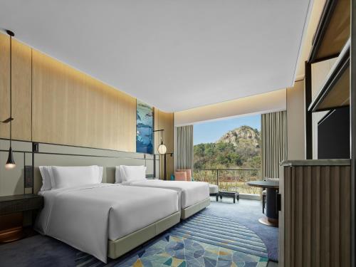 Imagen de la habitación del Hotel Angsana Suzhou Shishan. Foto 17