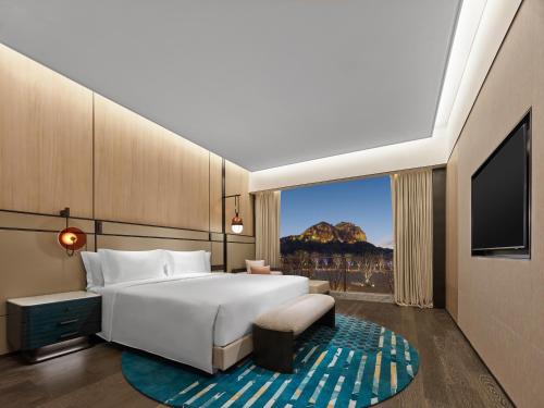 Imagen de la habitación del Hotel Angsana Suzhou Shishan. Foto 19