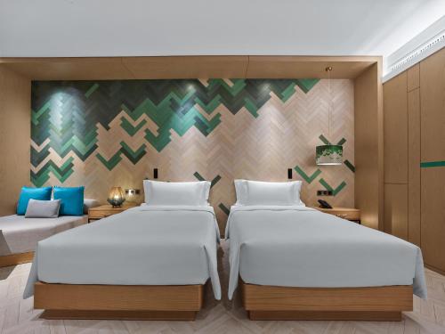 Imagen de la habitación del Hotel Angsana Tengchong. Foto 13